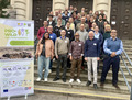 Consortium standing on the stairs in front of BOKU. A roll up showing the project key information is next to the group.